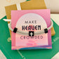 Make Heaven Crowded Cross Bracelet, Gray corded, black and white cross with card, box & ribbon included!